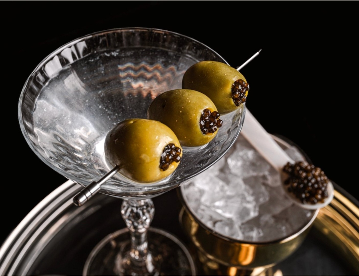 SALTÉ Caviar on dirty martini olives